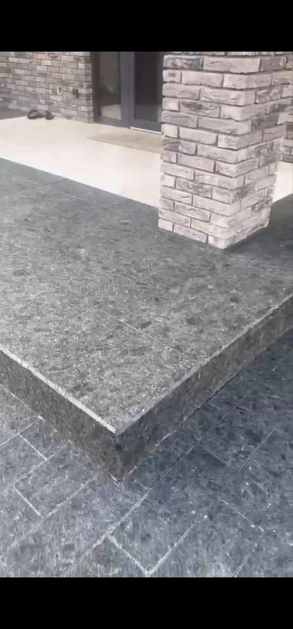 Black granite pavers at property entrance