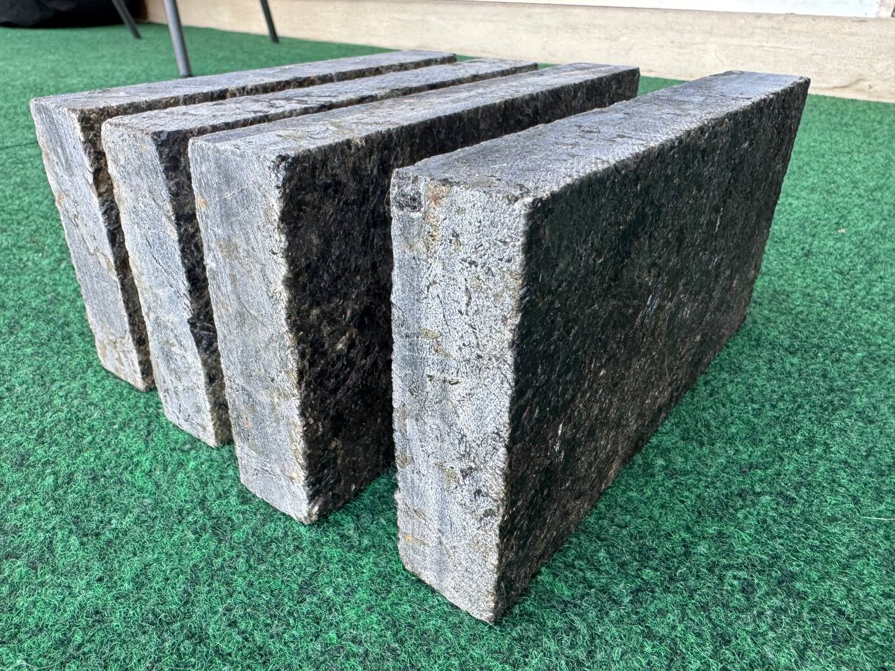 Black Ice L7 Labradorite pavers standing upright showing split face texture